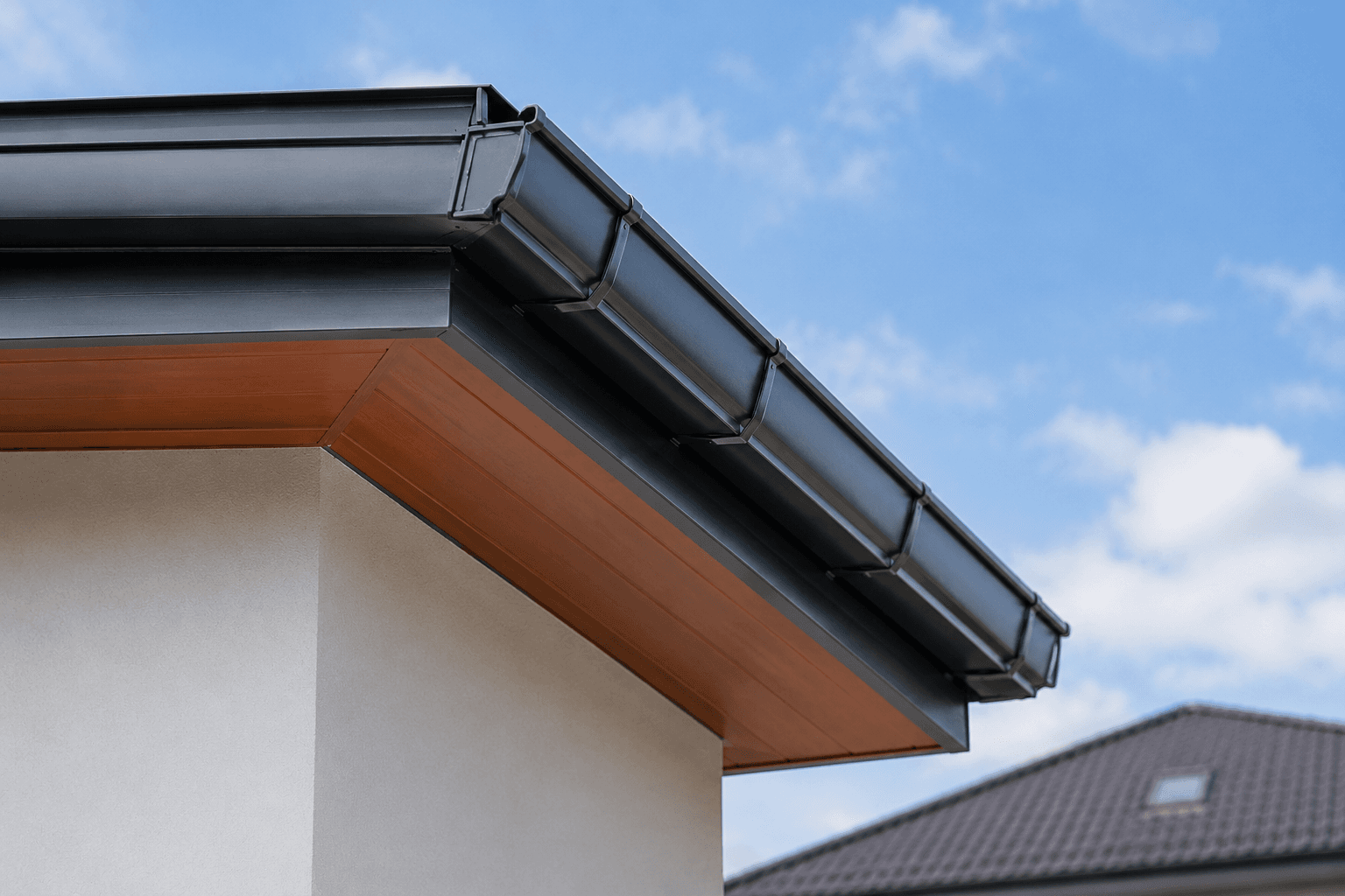 Roof gutter and flashing detail for rainwater drainage in Penang roofing work